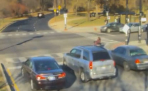 Mayor Emanuel caught running red light as man in wheelchair tries to cross street. Image from the red light camera video by WGN TV