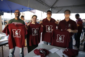 Morton High School District 201 School Board President Jeffry Pesek (2nd from right) rolls up his sleeves and works hard to promote the "Mustang Nation"