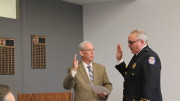 Orland Park Mayor Dan McLaughlin administers the oath of office to Michael Schofield as the Orland Fire Protection District's permanent Fire Chief