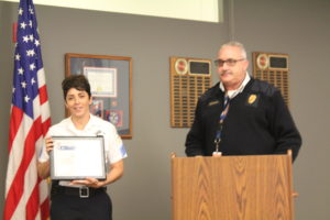 Sgt Cindy Guerra and Fire Chief Michael Schofield. Schofield presented Guerra with the William Bonnar Life Saving Award July 26, 2016